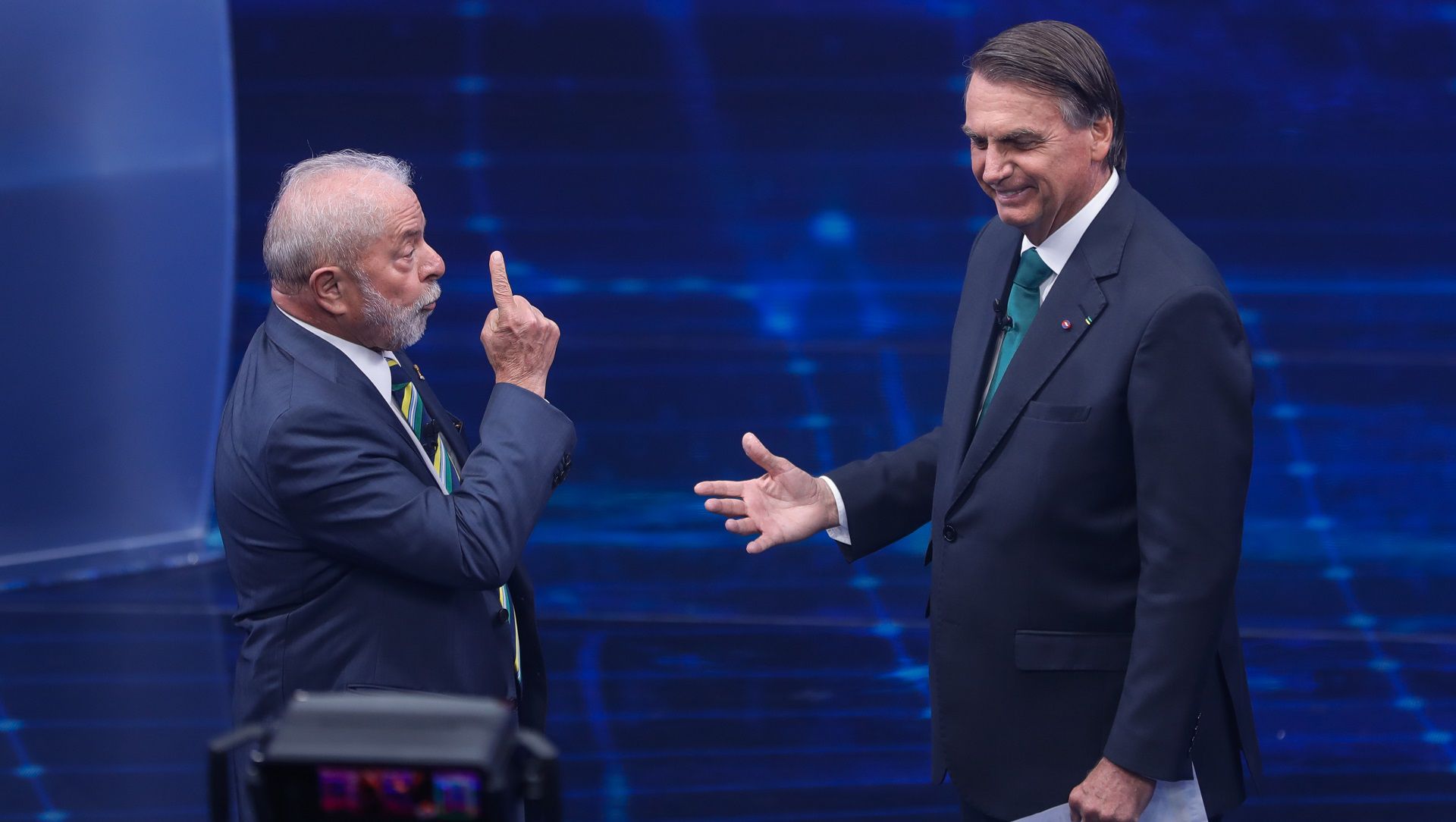 FILE - Brazil's former President Luiz Inacio Lula da Silva, left, and incumbent Jair Bolsonaro, take part in a presidential debate in Sao Paulo, Brazil, Oct. 16, 2022. During the first segment of their first one-on-one debate, they sought to convince poor voters that welfare payments will remain at their value. (AP Photo/Marcelo Chello, File)
