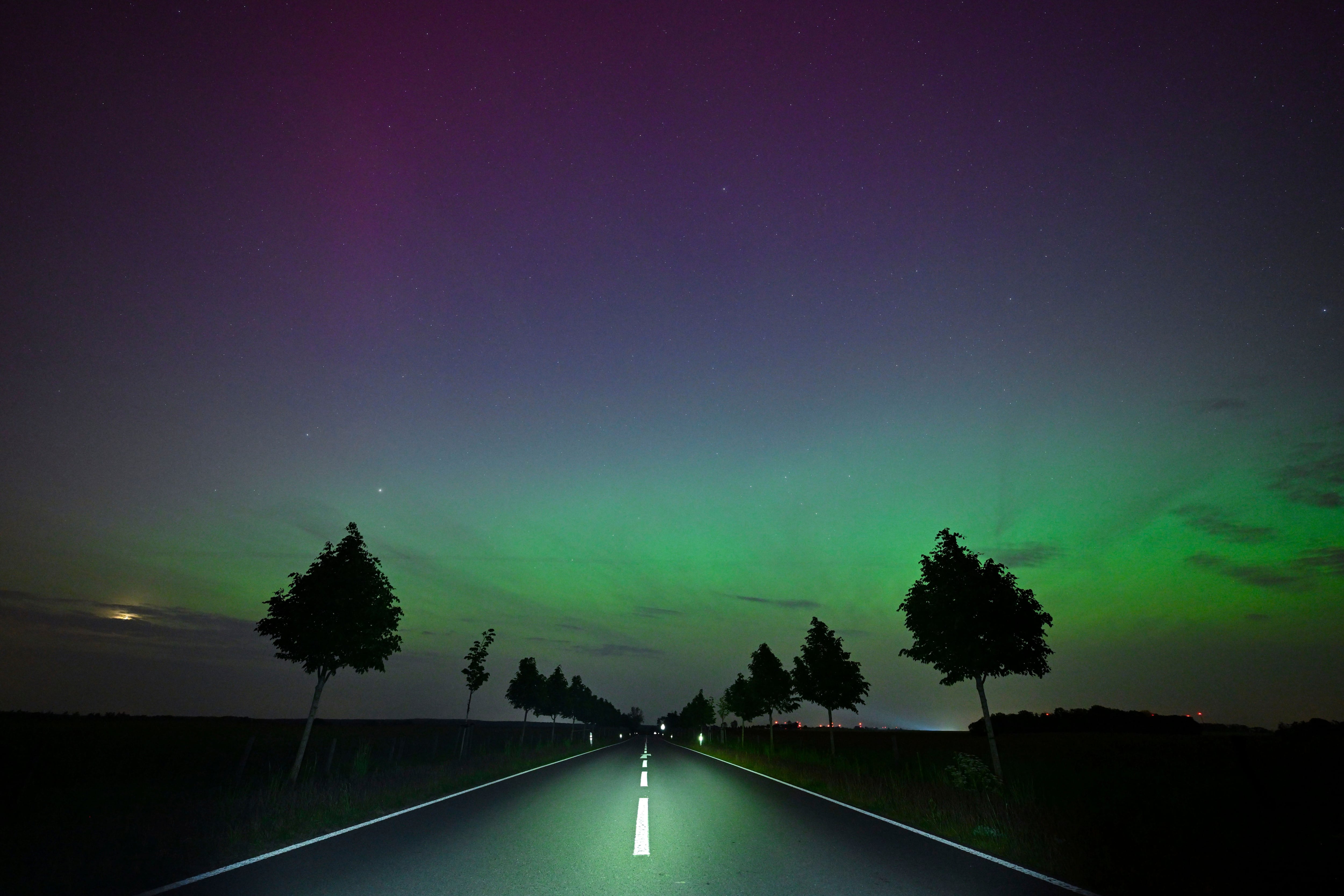 The Northern Lights appear in the night sky over East Brandenburg, Friday, May 10, 2024. (Patrick Pleul/dpa via AP)