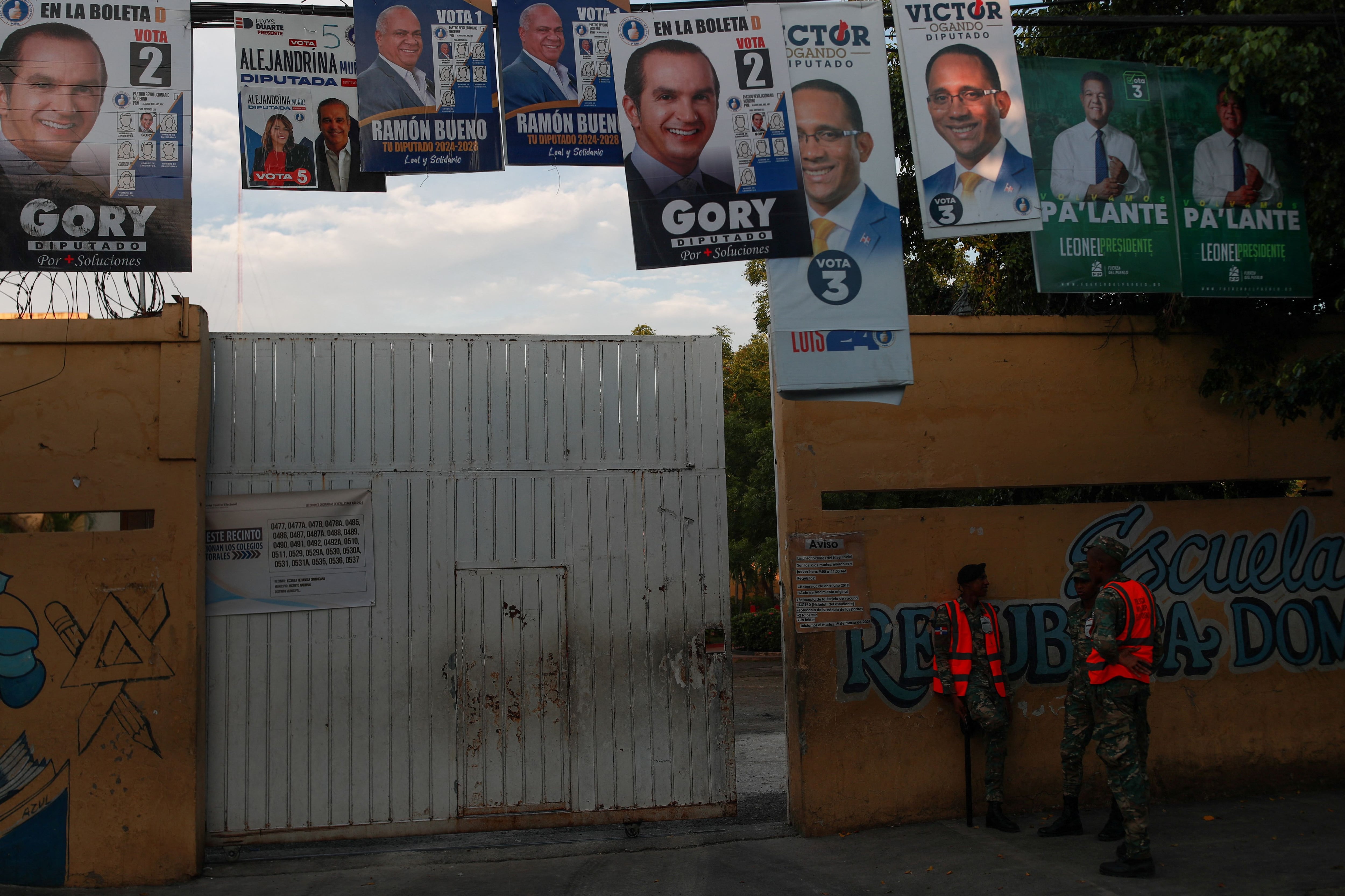 Military personnel stand watch outside a school used as a polling station, ahead of Sunday's elections, in Santo Domingo, Dominican Republic, May 18, 2024. REUTERS/Henry Romero