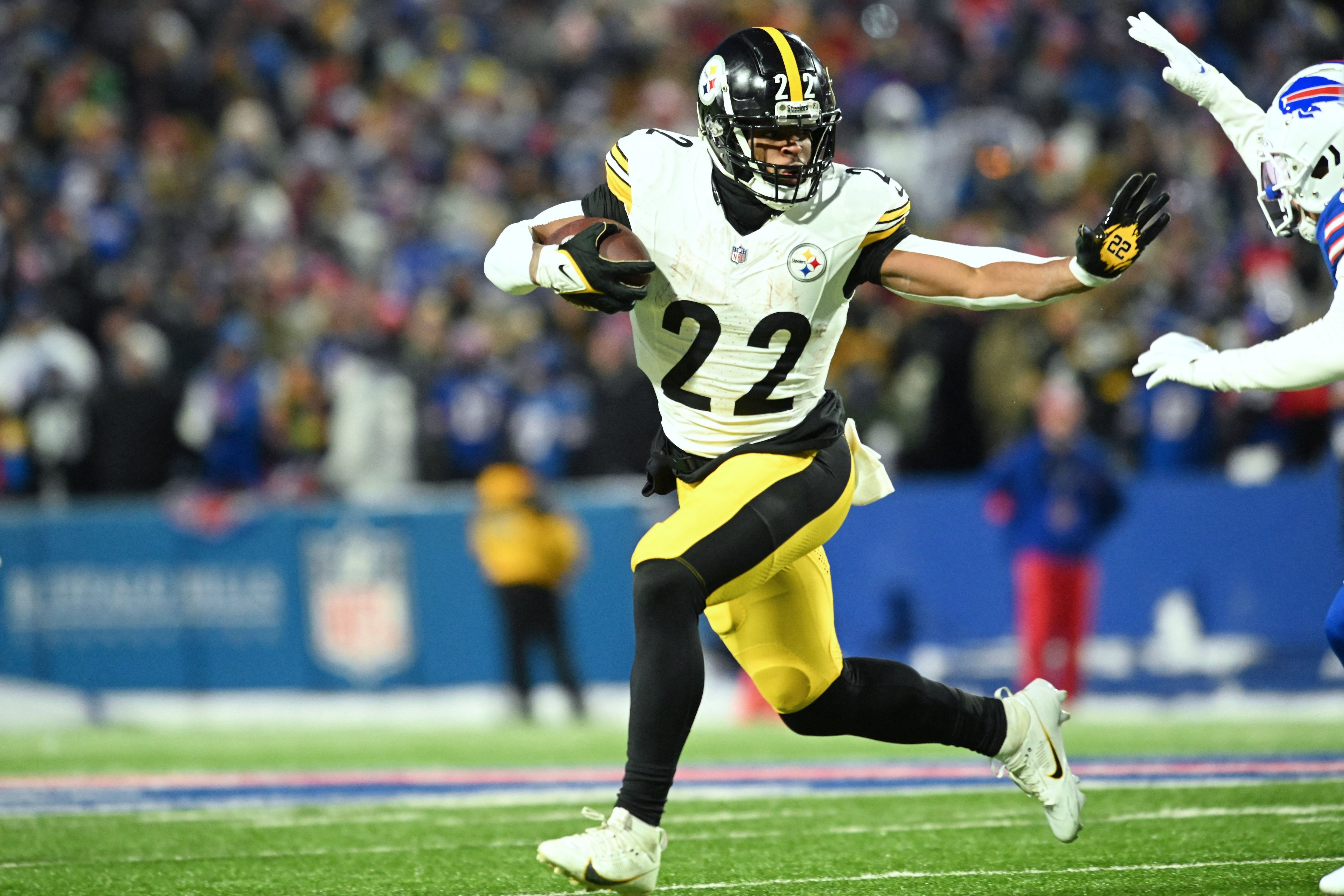 Jan 15, 2024; Orchard Park, New York, USA; Pittsburgh Steelers running back Najee Harris (22) runs the ball in the first half against the Buffalo Bills in a 2024 AFC wild card game at Highmark Stadium. Mandatory Credit: Mark Konezny-USA TODAY Sports