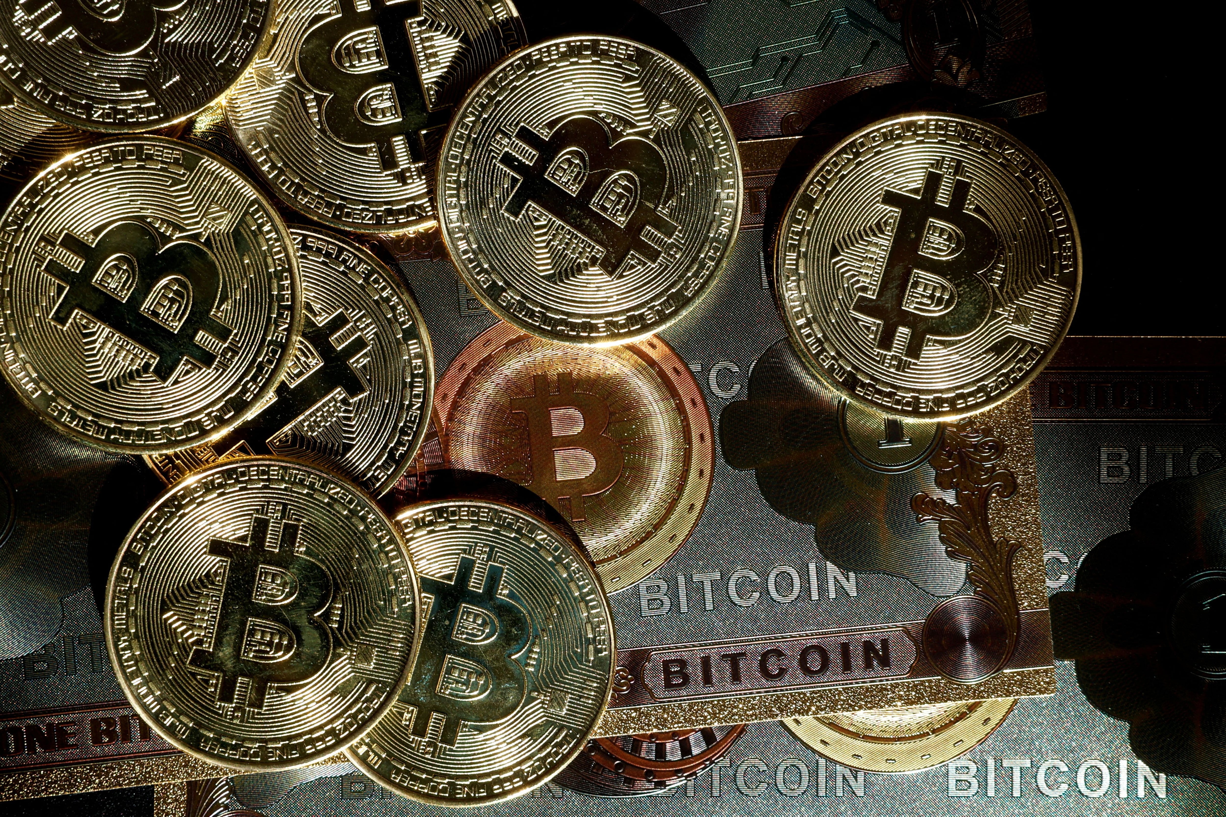 Representations of cryptocurrency Bitcoin (REUTERS/Benoit Tessier/Illustration/File Photo)