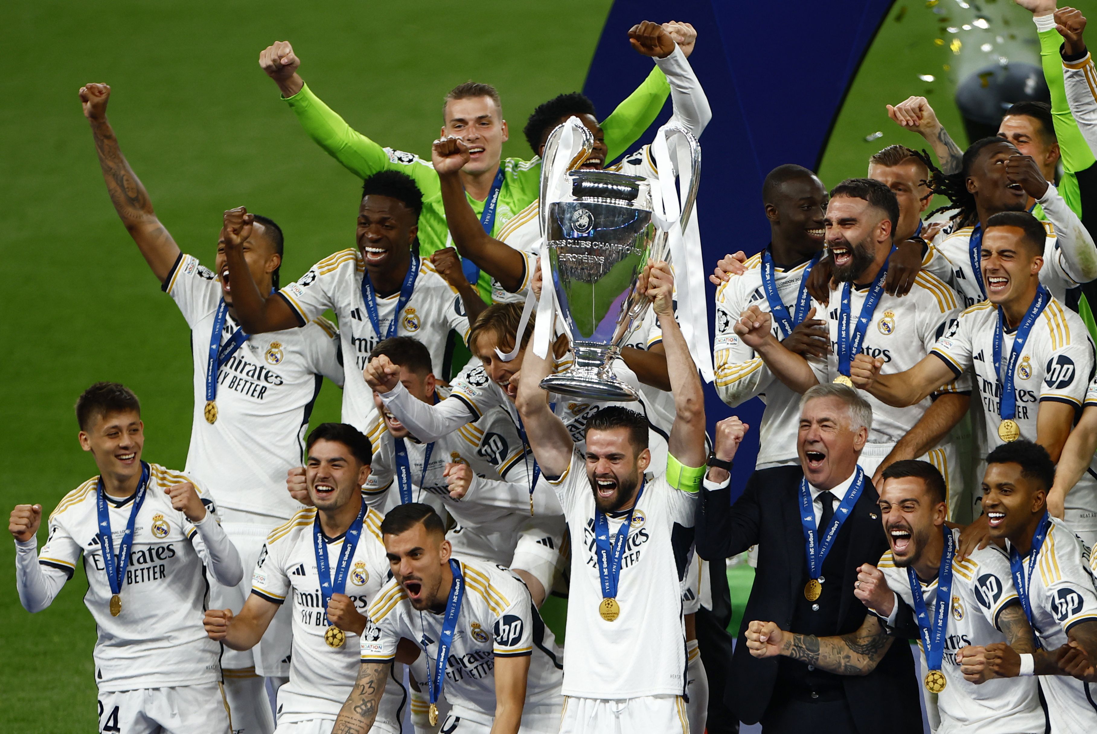 Soccer Football - Champions League - Final - Borussia Dortmund v Real Madrid - Wembley Stadium, London, Britain - June 1, 2024 Real Madrid's Nacho lifts the trophy as he celebrates with teammates after winning the Champions League REUTERS/Sarah Meyssonnier