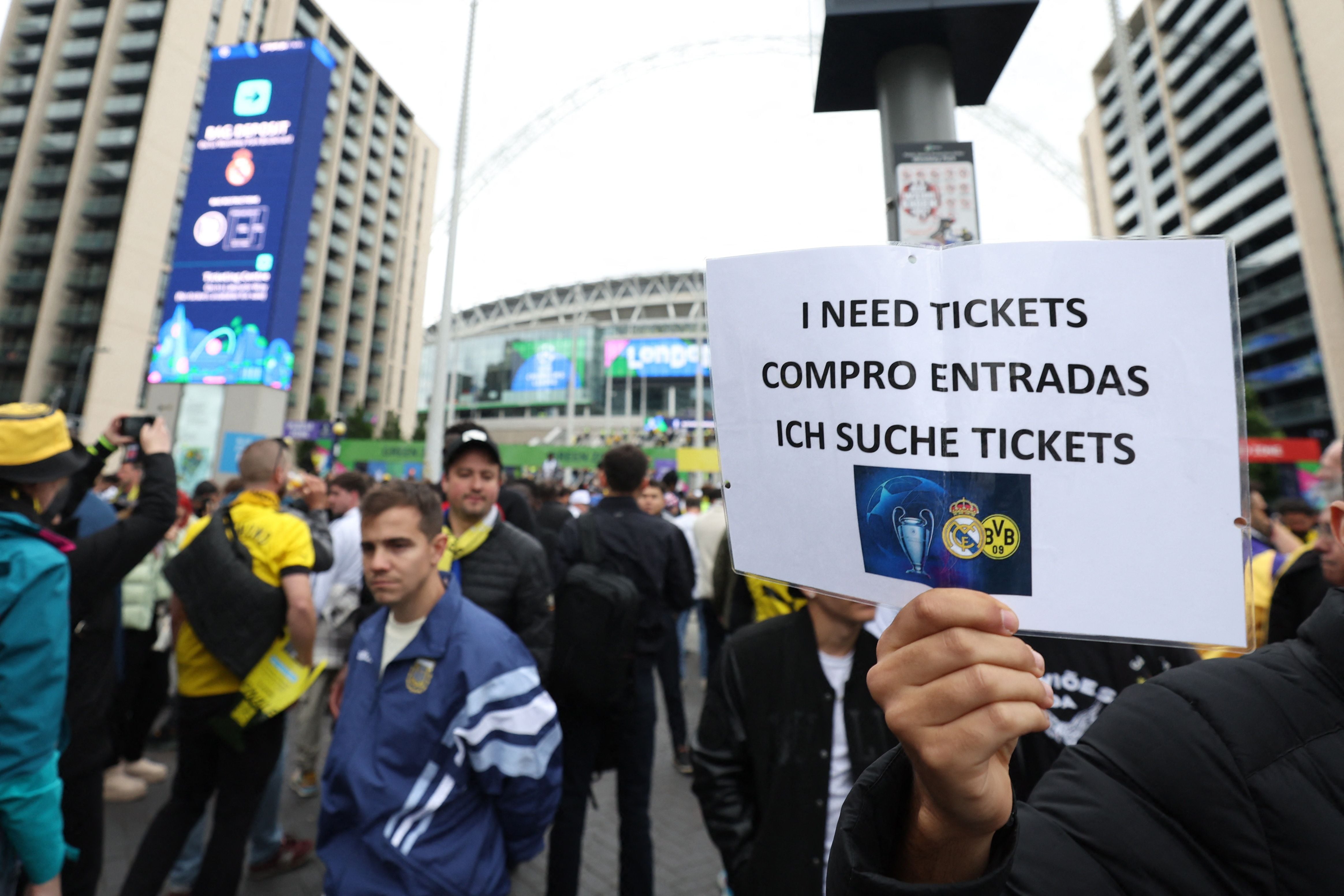 Soccer Football - Champions League - Final -  Borussia Dortmund v Real Madrid - London, Britain - June 1, 2024 A fan holds a sign reading "i need tickets" outside Wembley Stadium before the match Action Images via Reuters/Paul Childs